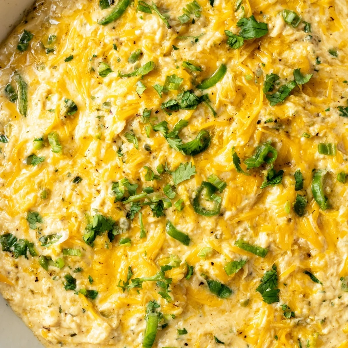 Perfect for game day, this Quarterback Queso Dip with Jalapenos is a creamy, spicy appetizer ready for dipping.  