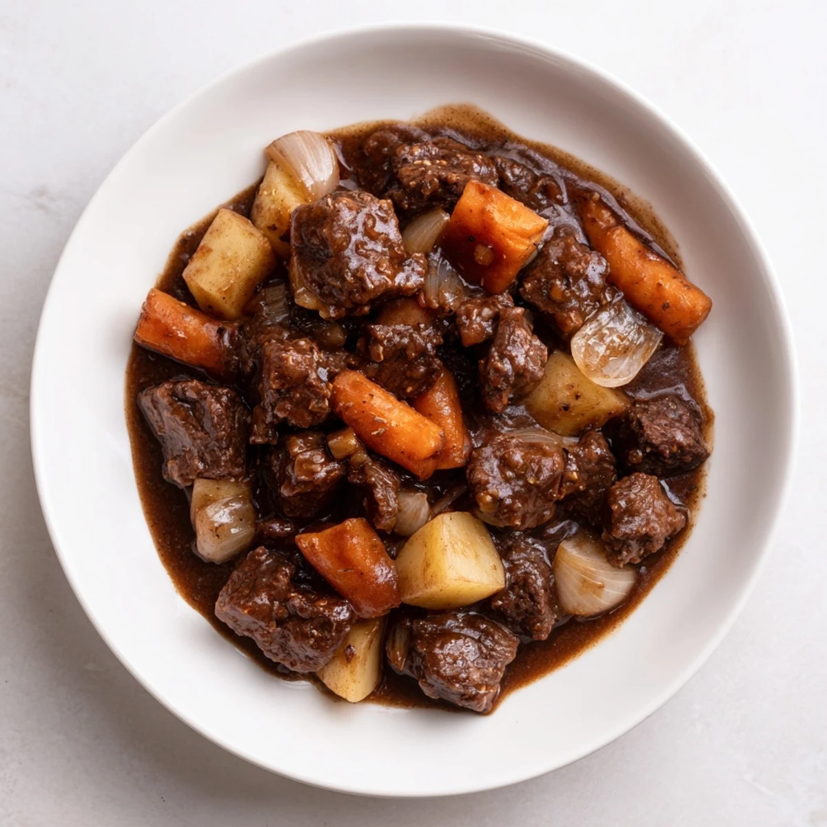 Rustic Dutch oven filled with hearty Guinness-Style Alcohol-Free Beef Stew, perfect for chilly weather.