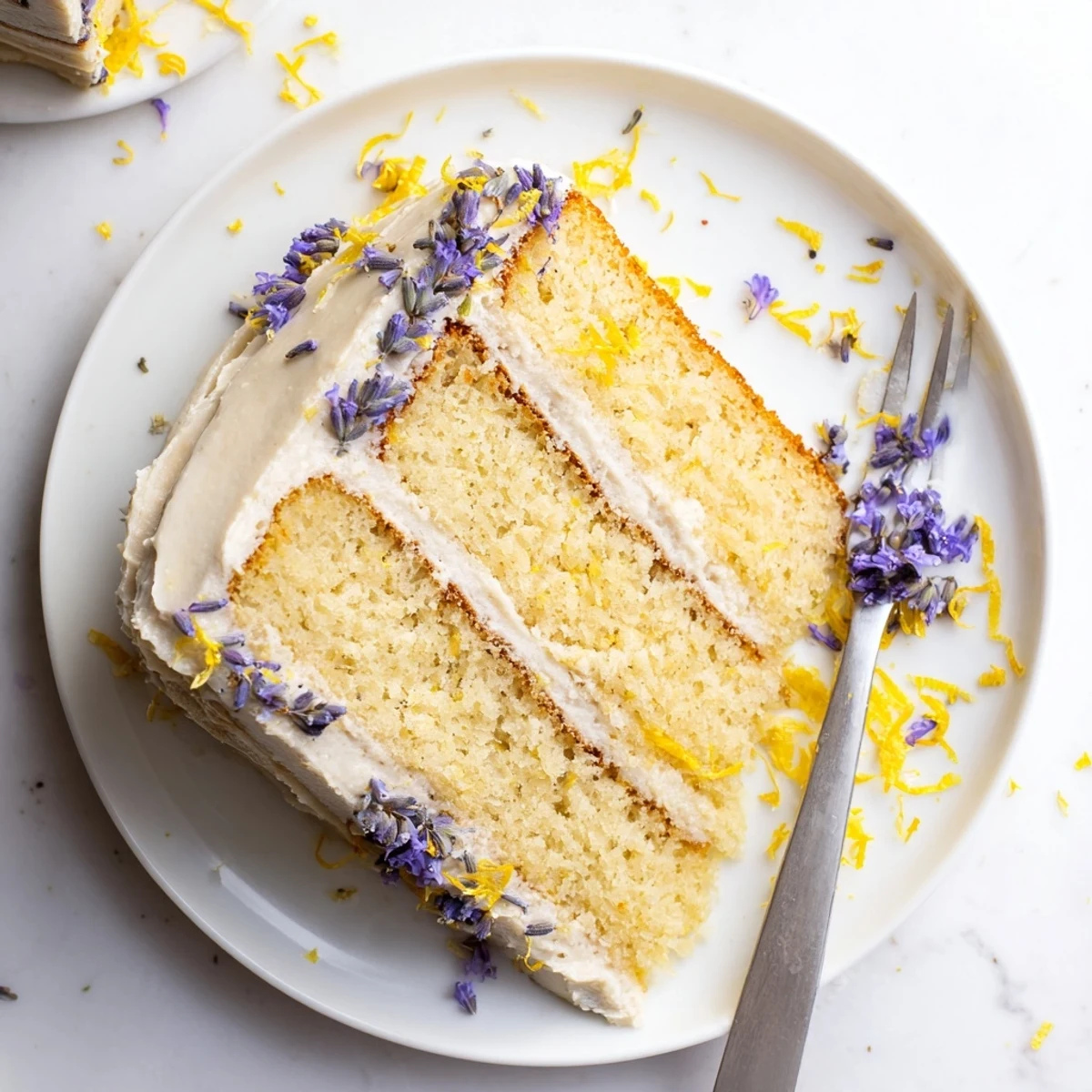 Close-up of the London Fog Cake with Earl Grey & Lavender highlights the fragrant Earl Grey sponge and smooth vanilla frosting, ready to serve.