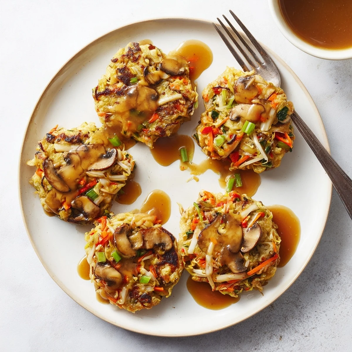 Fluffy Chinese-style Egg Foo Young omelet fried until perfectly crisp and golden