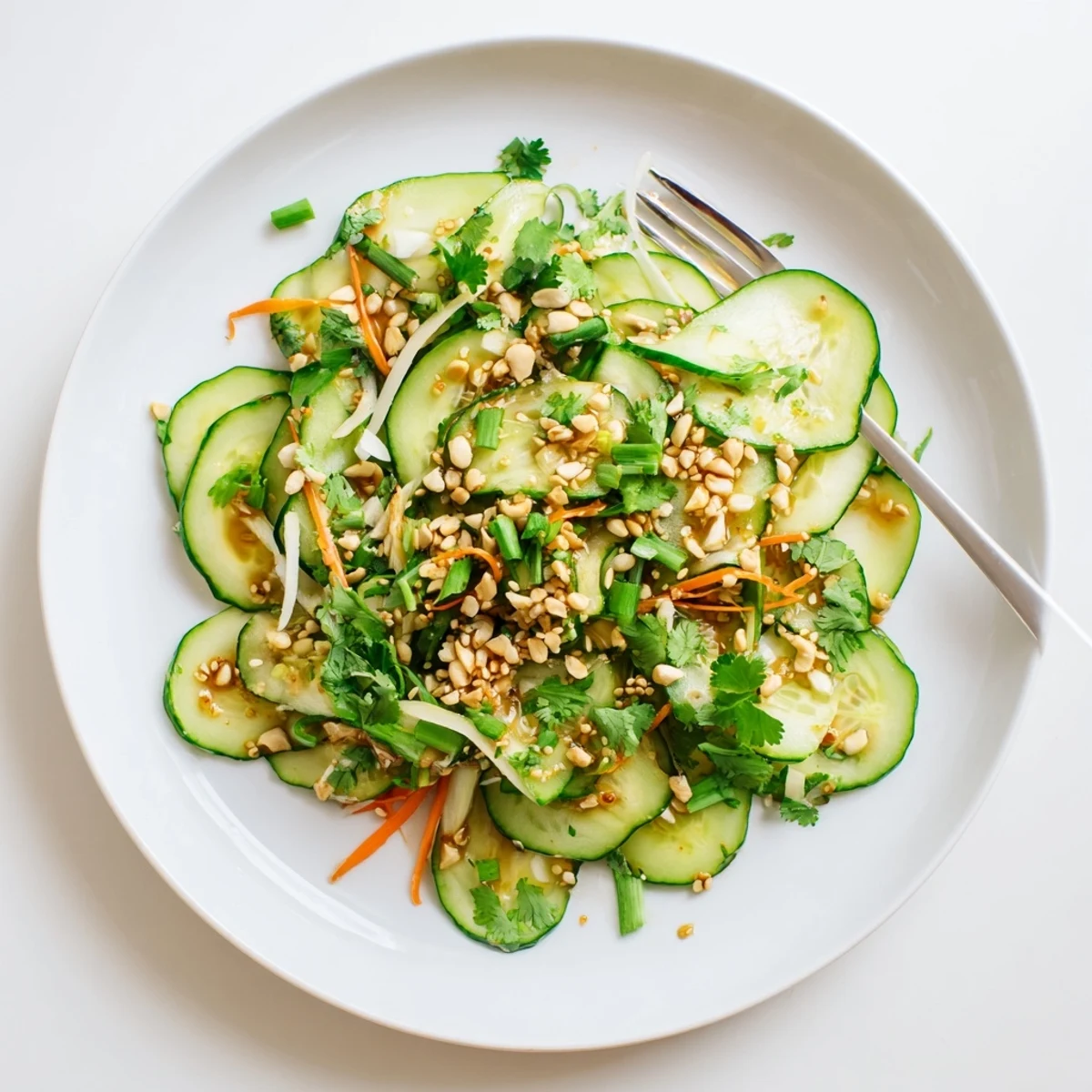 Garden-fresh cucumber slices marinated in savory Asian dressing with red pepper flakes and toasted sesame seed topping