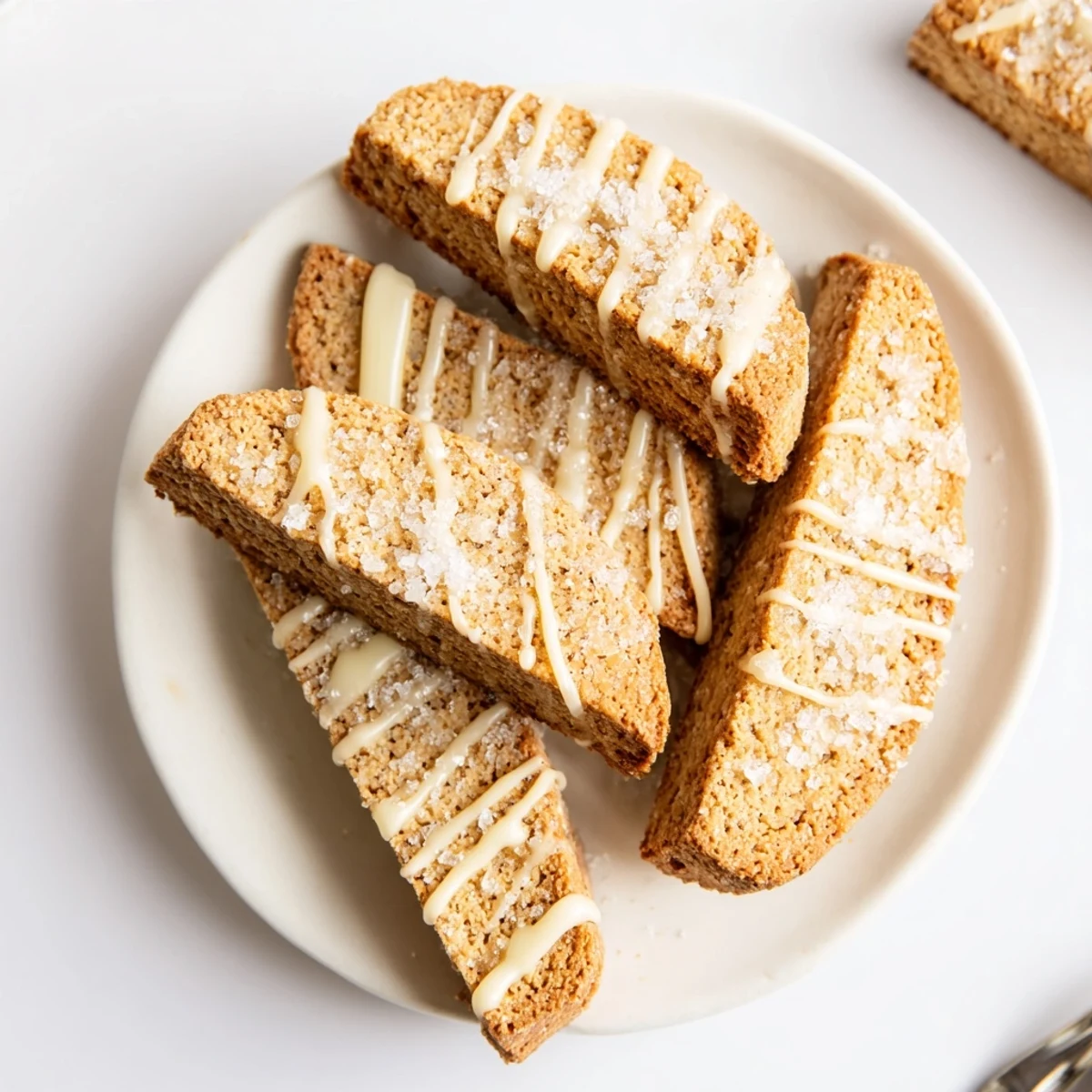 Crisp Italian-American sugar cookie biscotti arranged on a rustic wooden serving platter
