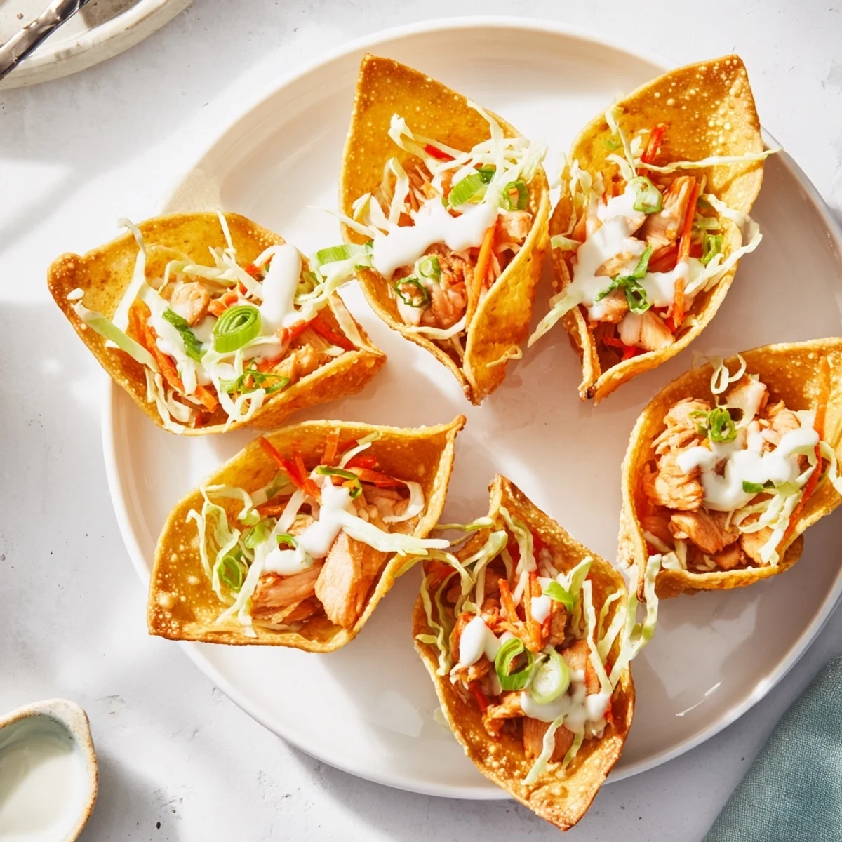 Golden crispy chicken wonton tacos filled with savory seasoned chicken and colorful vegetable slaw