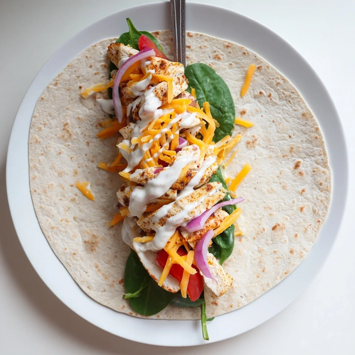 Golden low carb cheesy garlic chicken wraps filled with tender grilled meat and melted mozzarella cheese