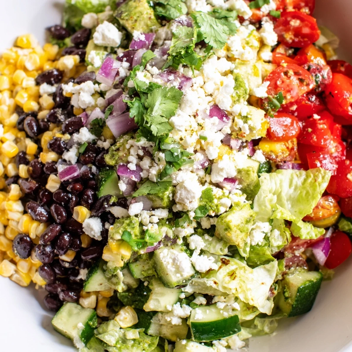 Mexican chopped salad featuring crisp lettuce tomatoes black beans and zesty lime dressing