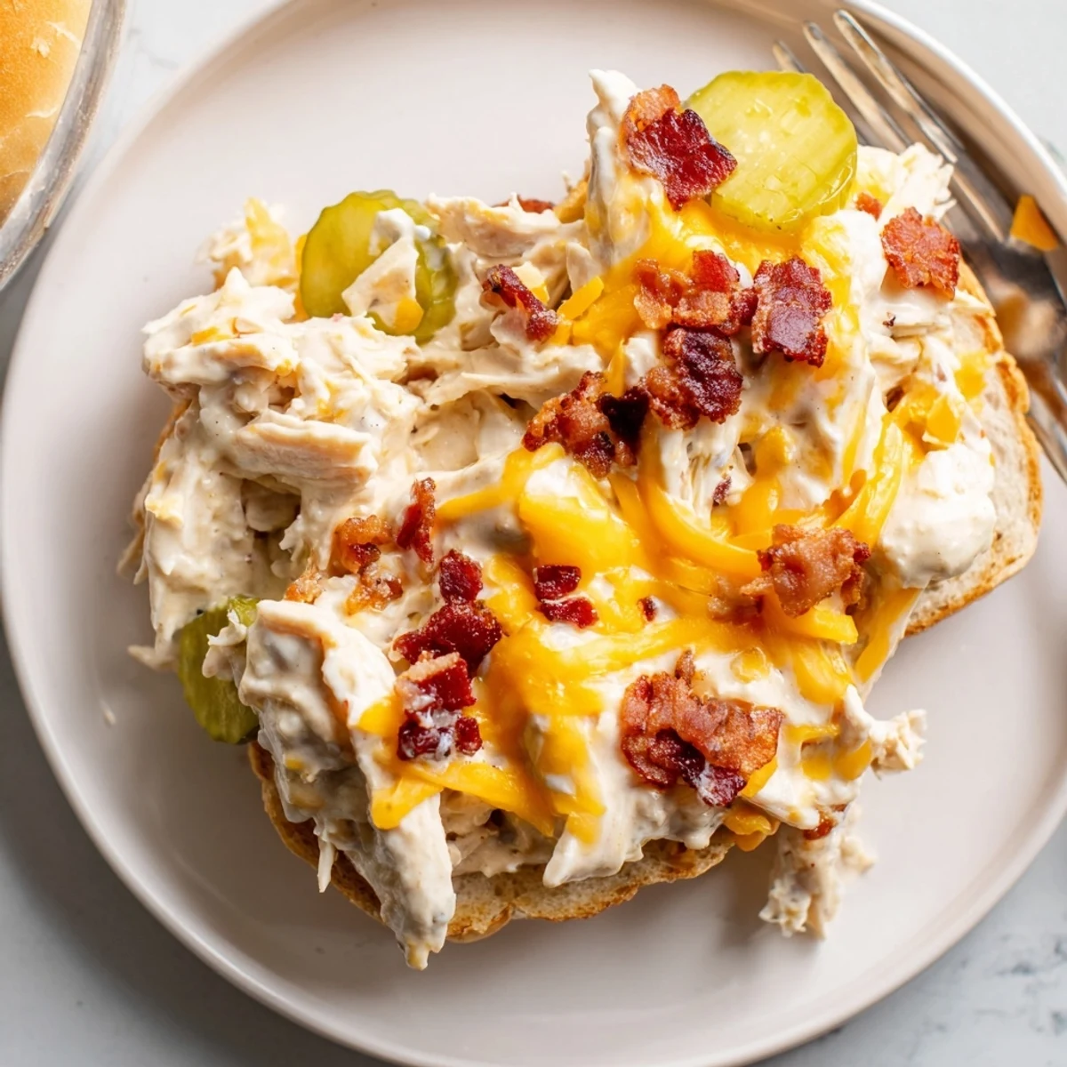 Crack Chicken Sandwiches mounded on buns, creamy cheddar interior, perfect with iced tea