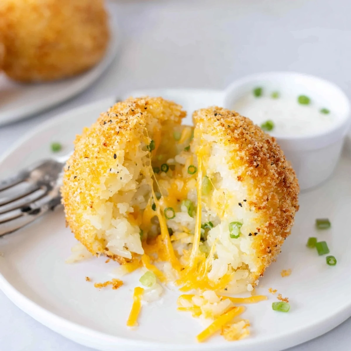 Close-up of Fried Mashed Potato Balls showing golden crumbs and creamy center