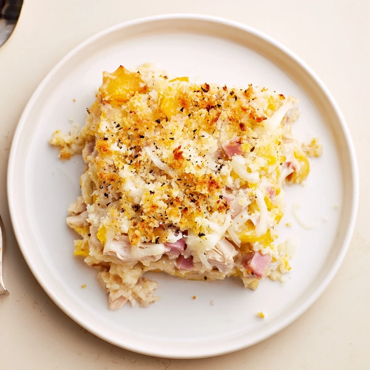 Golden, bubbling Chicken Cordon Bleu Casserole with melted Swiss and crunchy topping