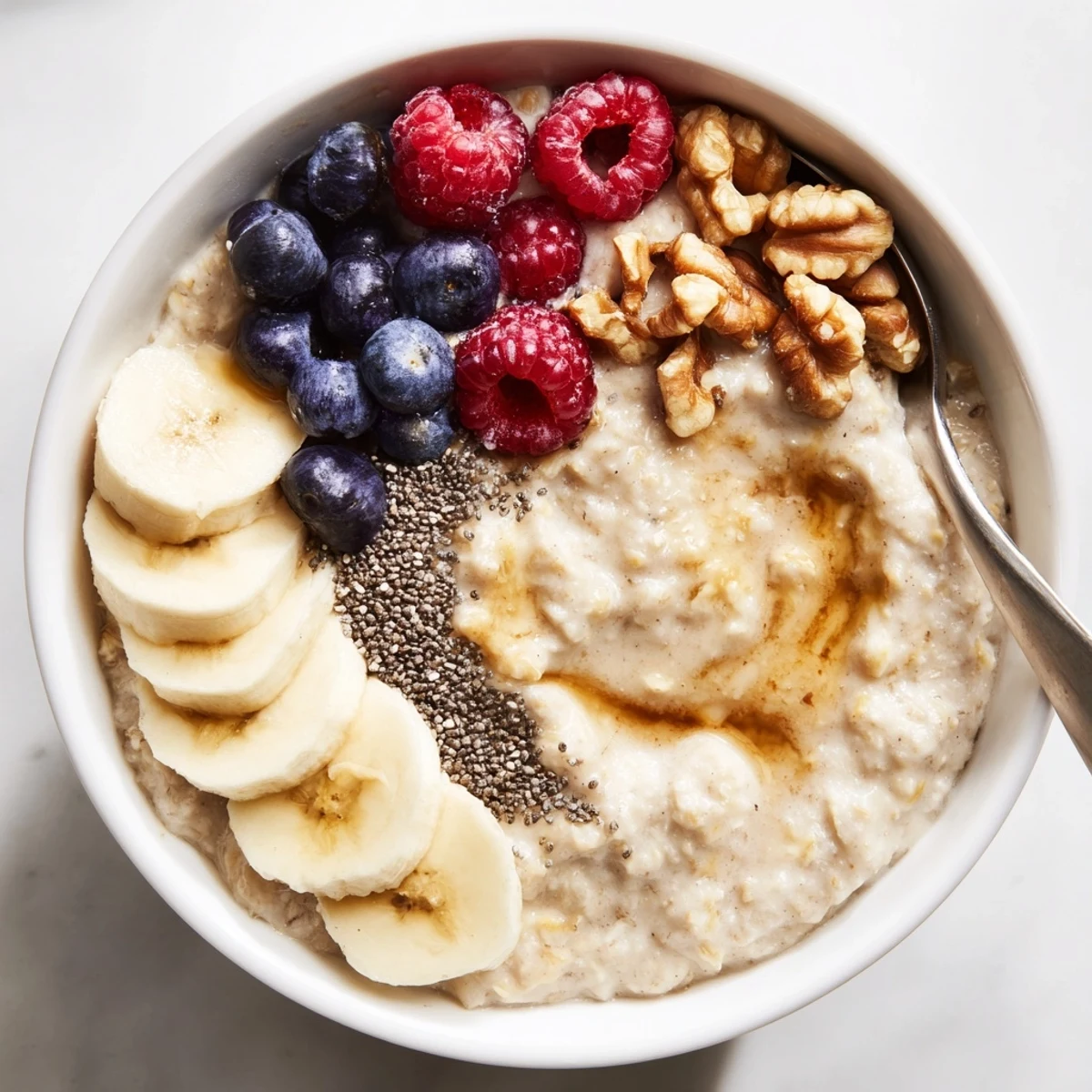 Hearty Protein Oatmeal with crunchy nuts and chia, spoon-ready, post-workout.
