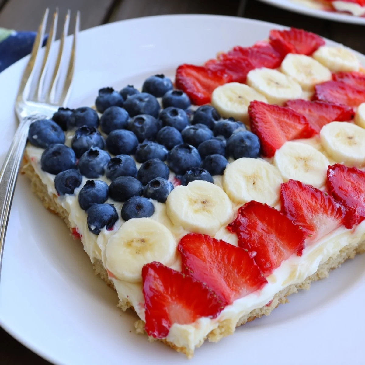 Sliced American Flag Fruit Pizza chilled, sweet strawberries, banana stripes, blueberry canton