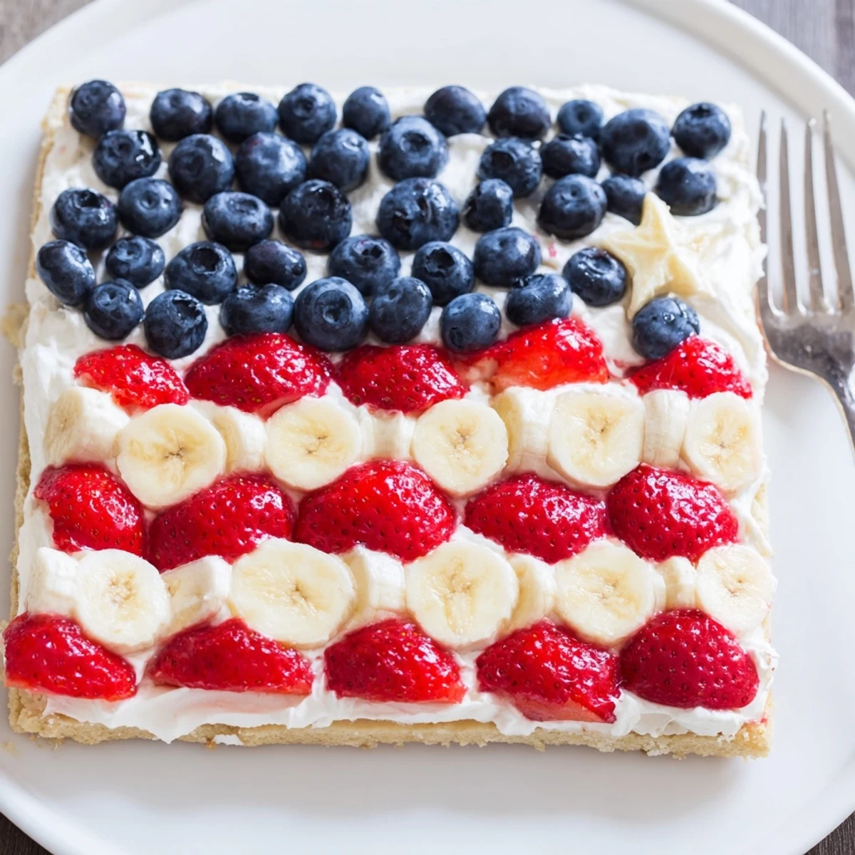 Festive American Flag Fruit Pizza, sugar cookie crust with tangy cream cheese frosting
