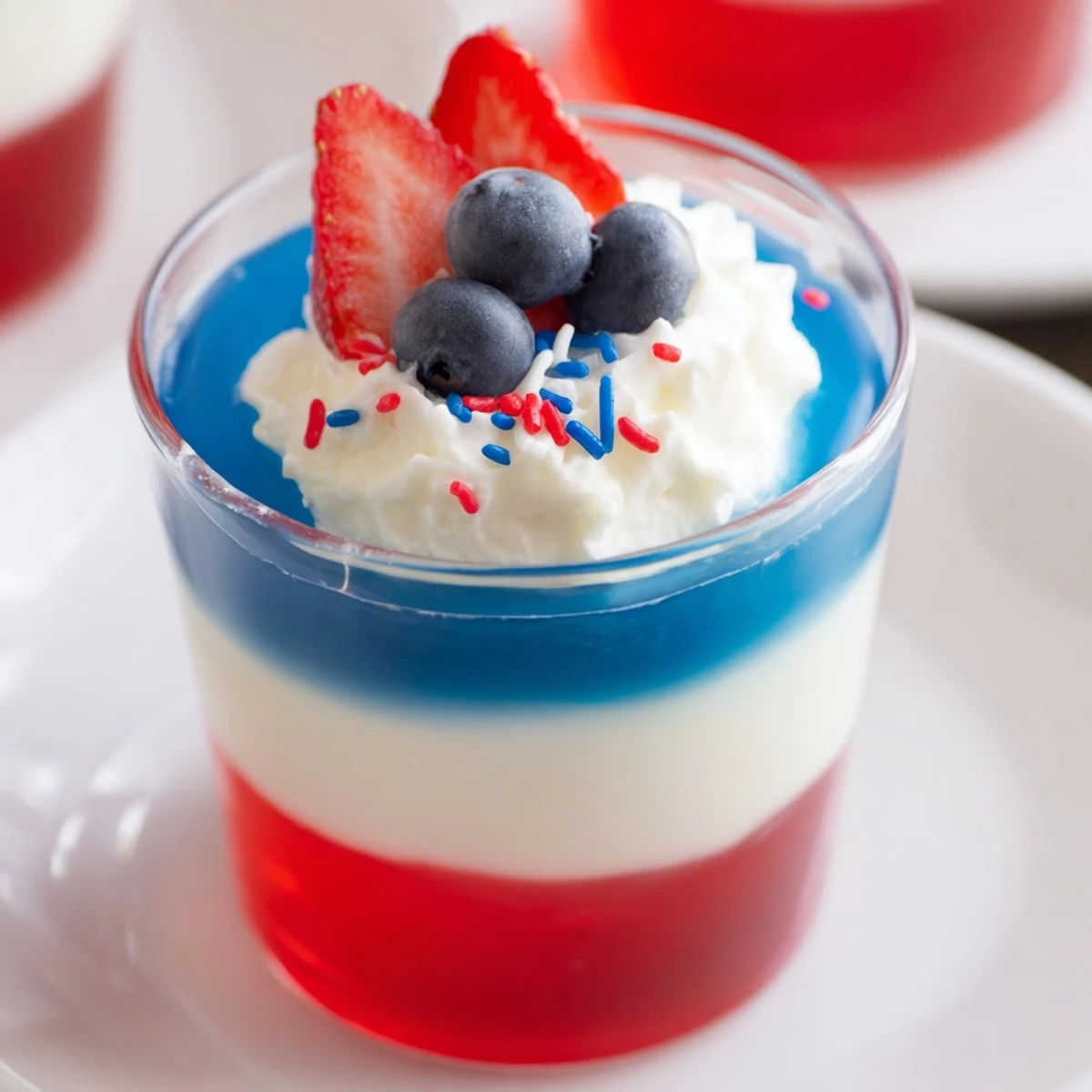Kids and adults share Red White And Blue Jello Cups at summer parties