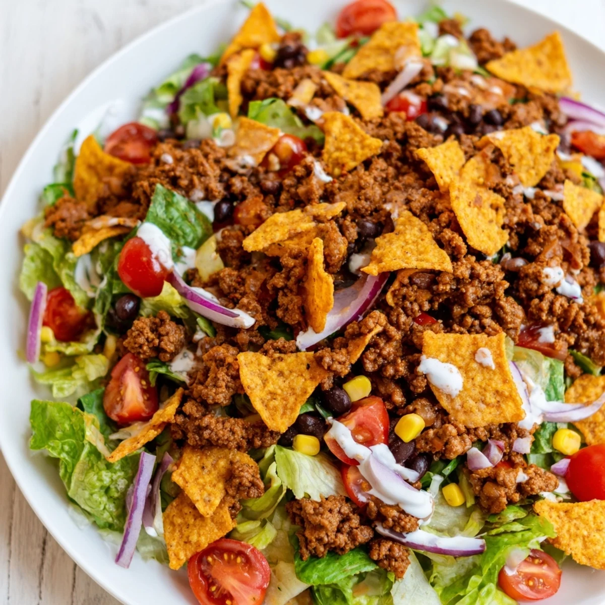 Simple Doritos Taco Salad with crunchy chips, seasoned beef, and creamy ranch