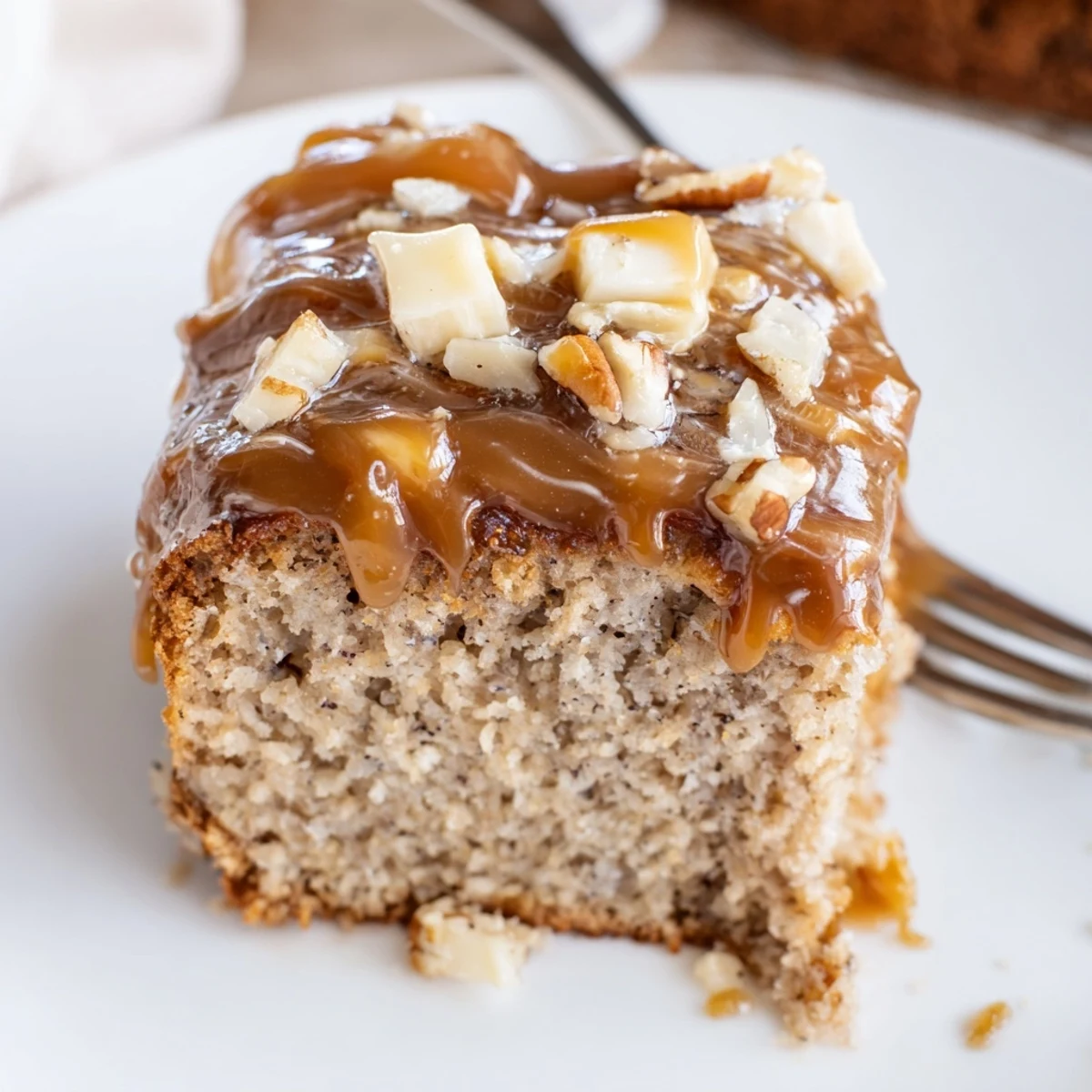 Warm wedge of Salted Caramel Brown Butter Banana Cake served with ice cream