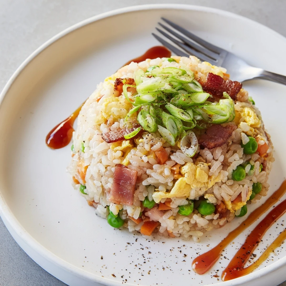 Hearty Breakfast Fried Rice tossed with peas, scallions, savory soy aroma