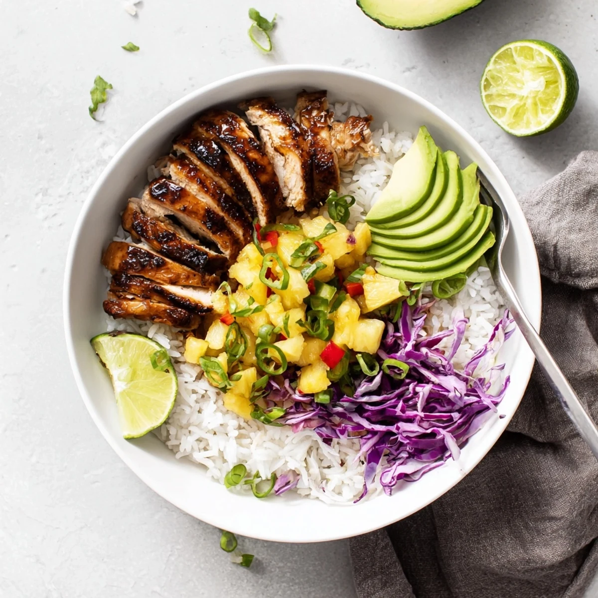 Charred, spiced chicken, creamy avocado, tangy lime finishing Jerk Chicken Bowl With Pineapple Salsa