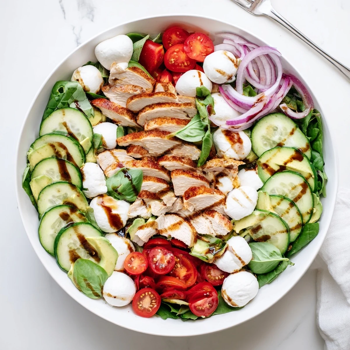 Baked Marinated Chicken Salad With Mozzarella And Balsamic Vinaigrette, sliced chicken glistening