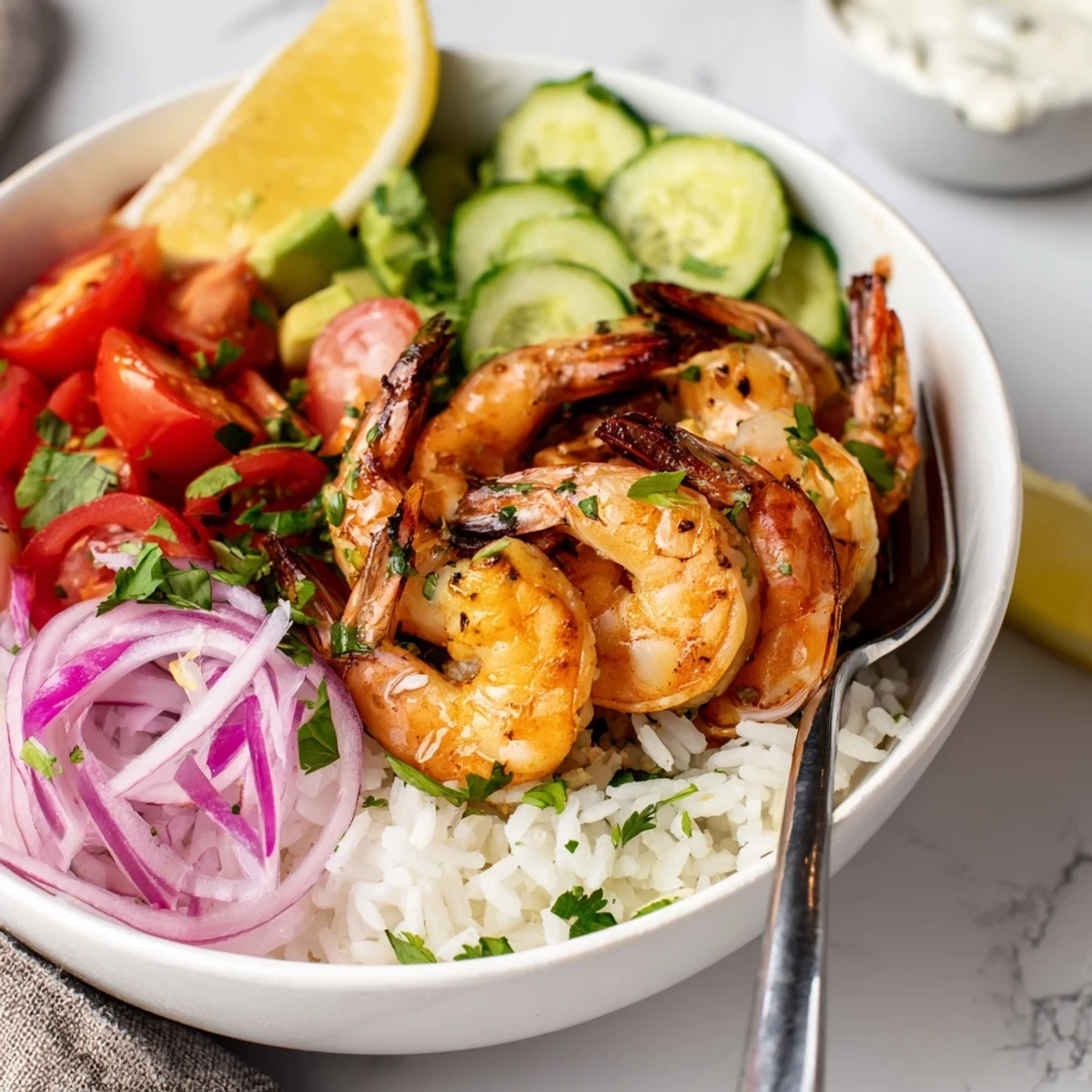 Garlic Shrimp Bowl with juicy seared shrimp, avocado, tomatoes, and cilantro