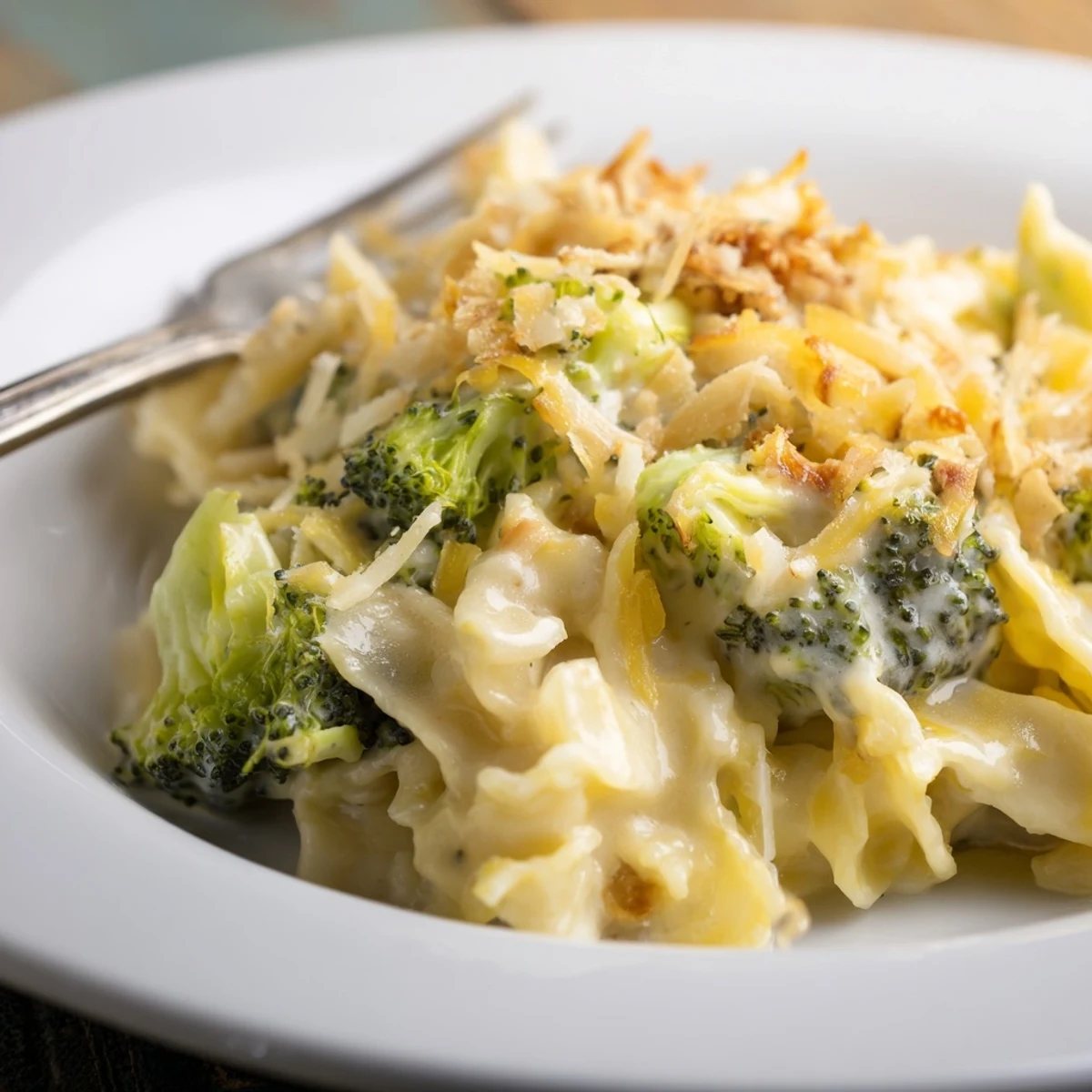 Oven-browned Broccoli Cheddar Noodle Skillet topped with golden breadcrumbs, bubbling cheese edges