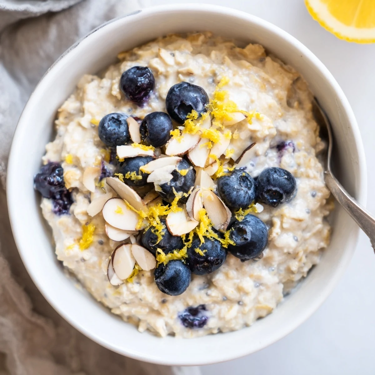 Chilled Blueberry Lemon Overnight Oats finished with bright lemon zest and maple syrup