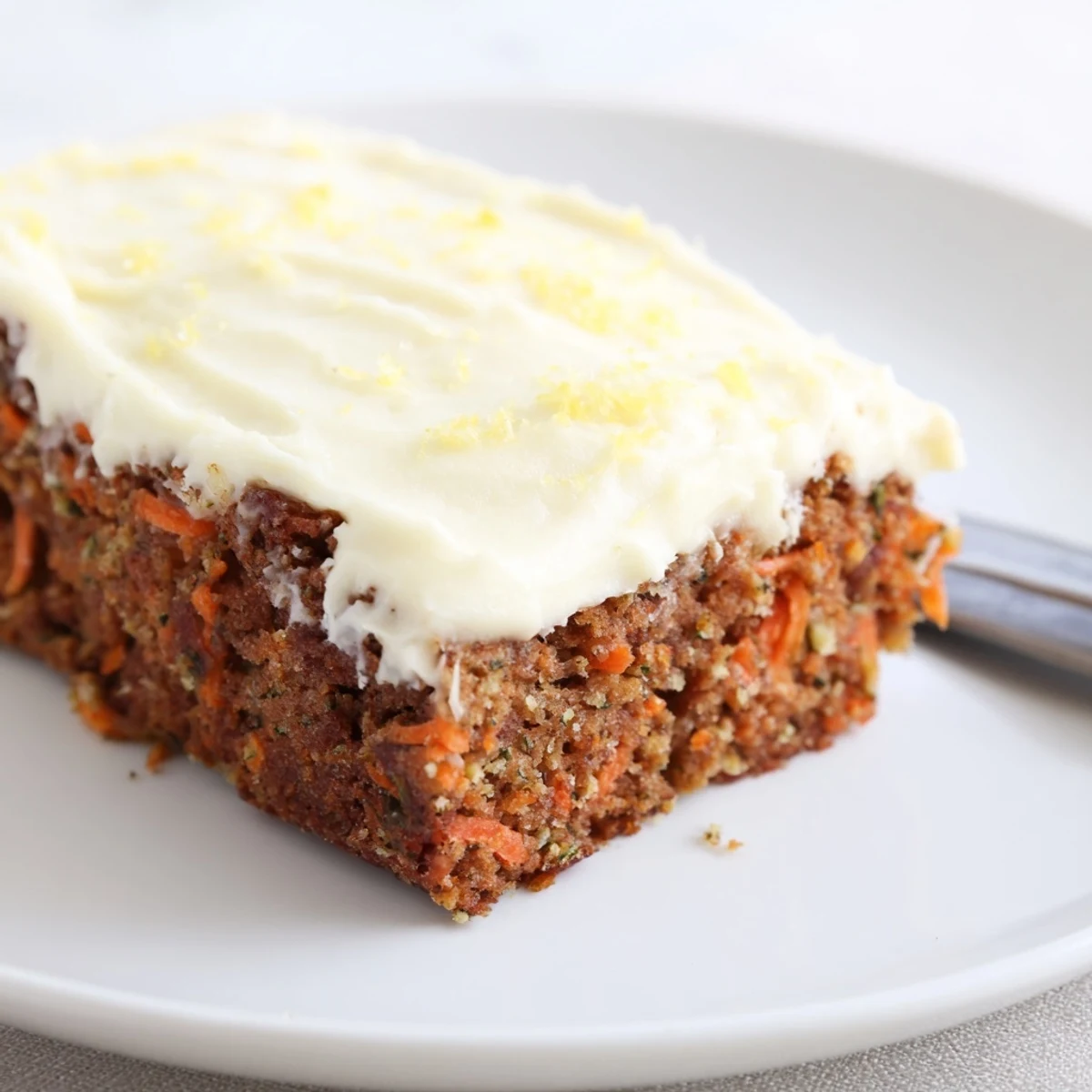 Warm, zesty Spiced Ginger Carrot And Zucchini Bars With Lemon Cream Cheese Frosting