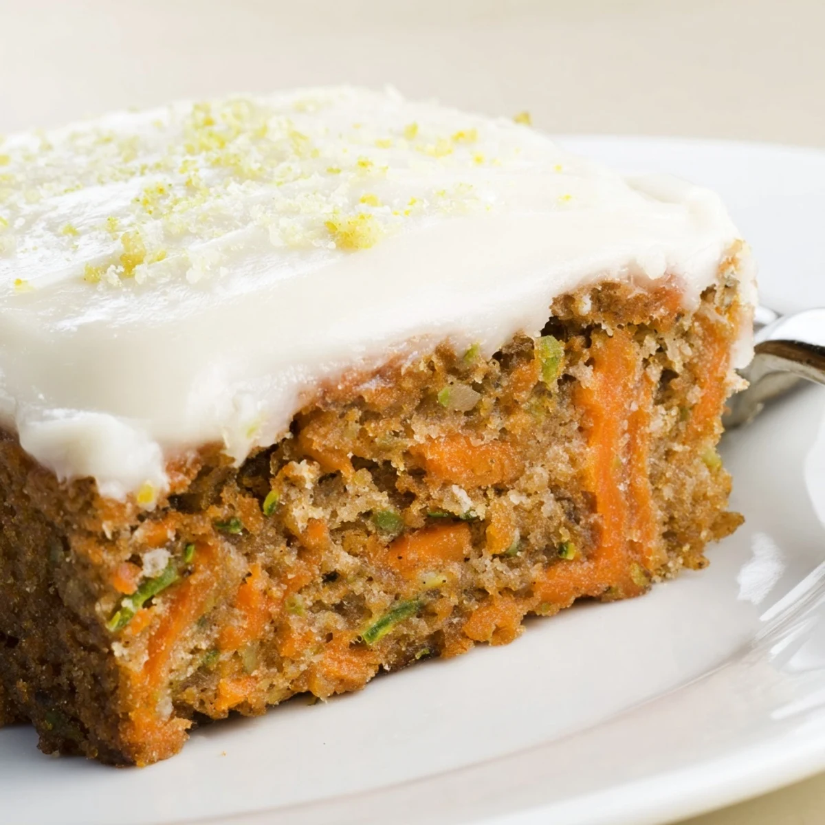 Spiced Ginger Carrot And Zucchini Bars With Lemon Cream Cheese Frosting served with tea