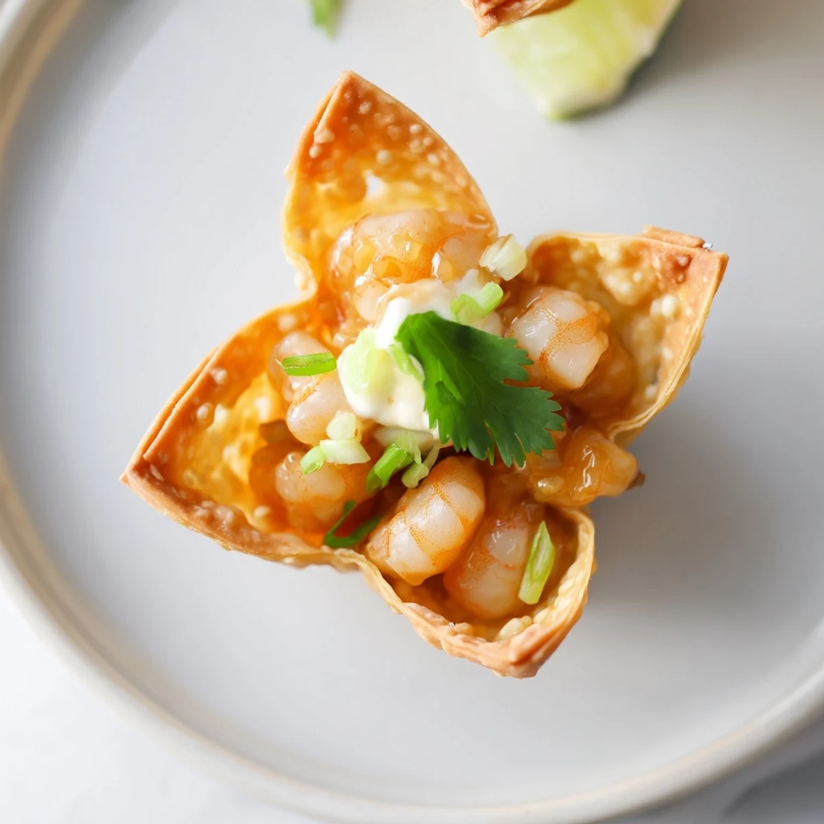 Serve immediately: Crispy Shrimp Wonton Cups With Lime Cream garnished with spring onions