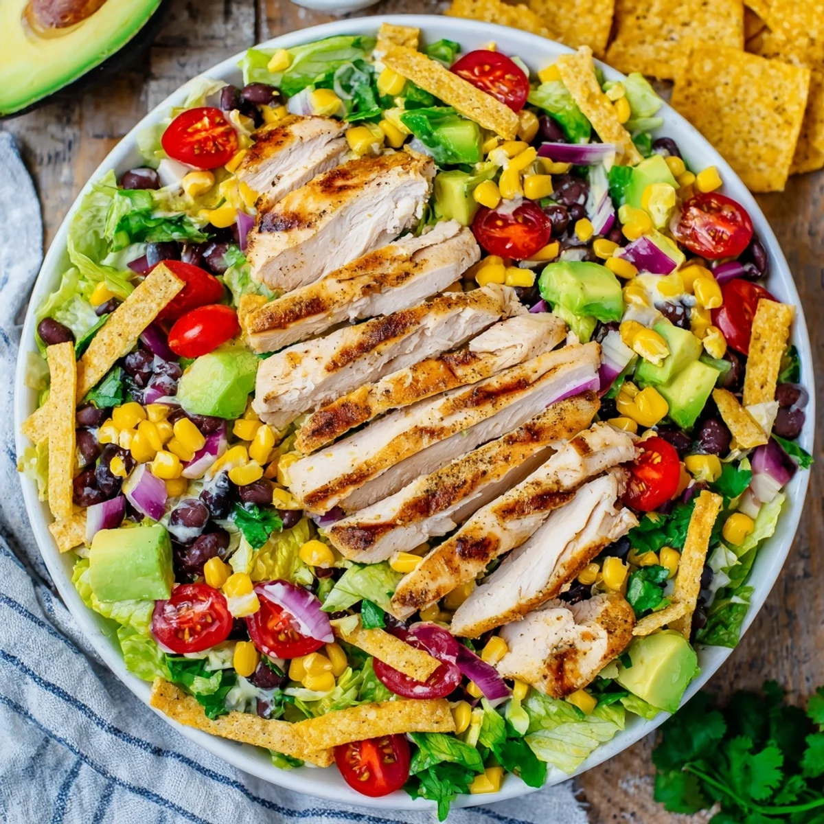 Zesty Southwestern chicken salad featuring spiced grilled chicken over crisp romaine with vibrant toppings and creamy dressing