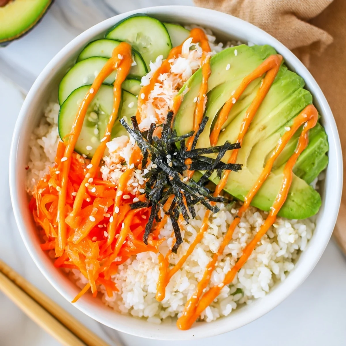 California Roll Sushi Bowls with creamy avocado, shredded crab, and sesame drizzle