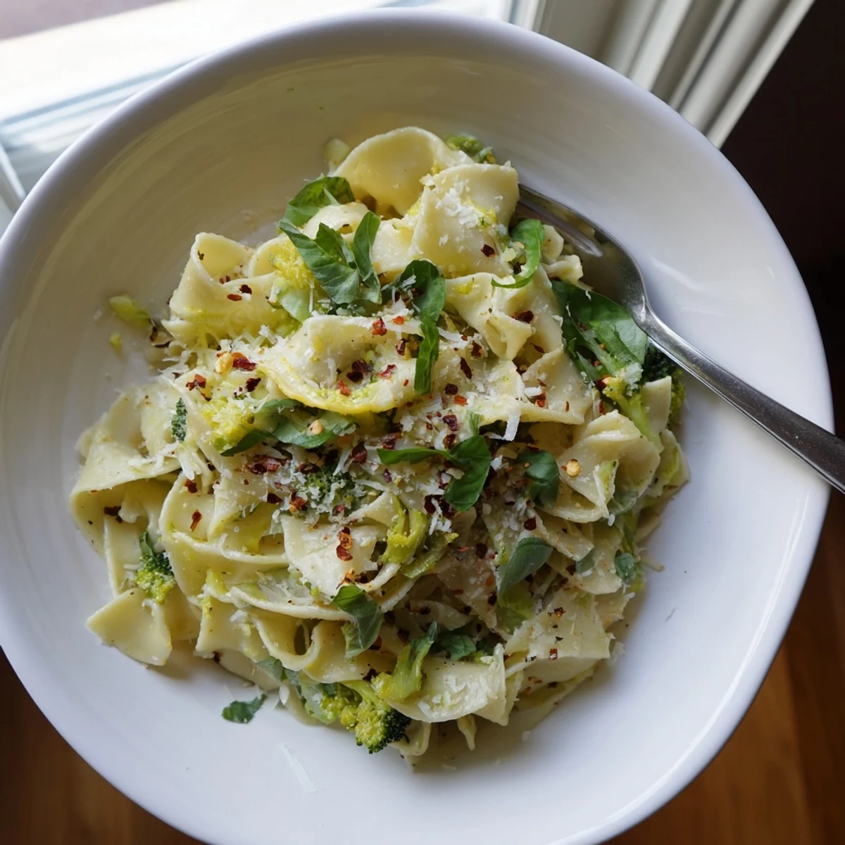 Bright mafaldine limone broccoli pasta tossed in a silky lemon Parmesan sauce with fresh basil