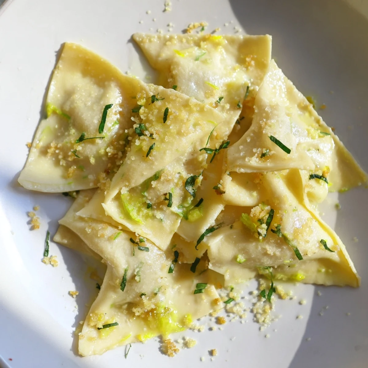 Golden leek burrata triangoli tossed in lemon butter sauce with crispy breadcrumbs