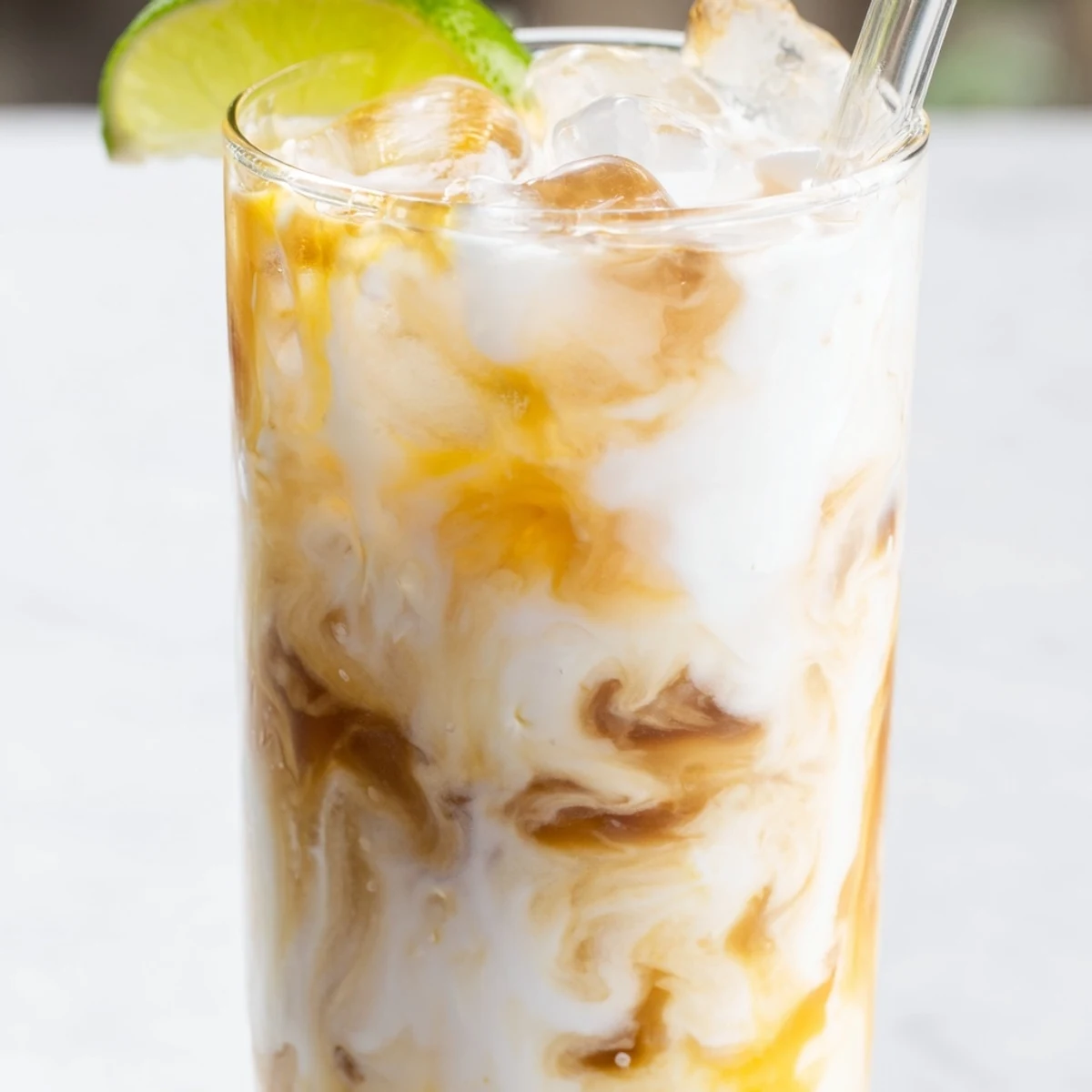 Tropical Thunder Dirty Soda featuring golden tropical syrup layers in a refreshing chilled beverage