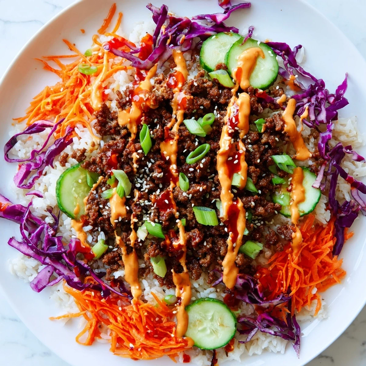Ground Turkey Rice Bowls topped with crunchy slaw and a generous swirl of spicy mayo.