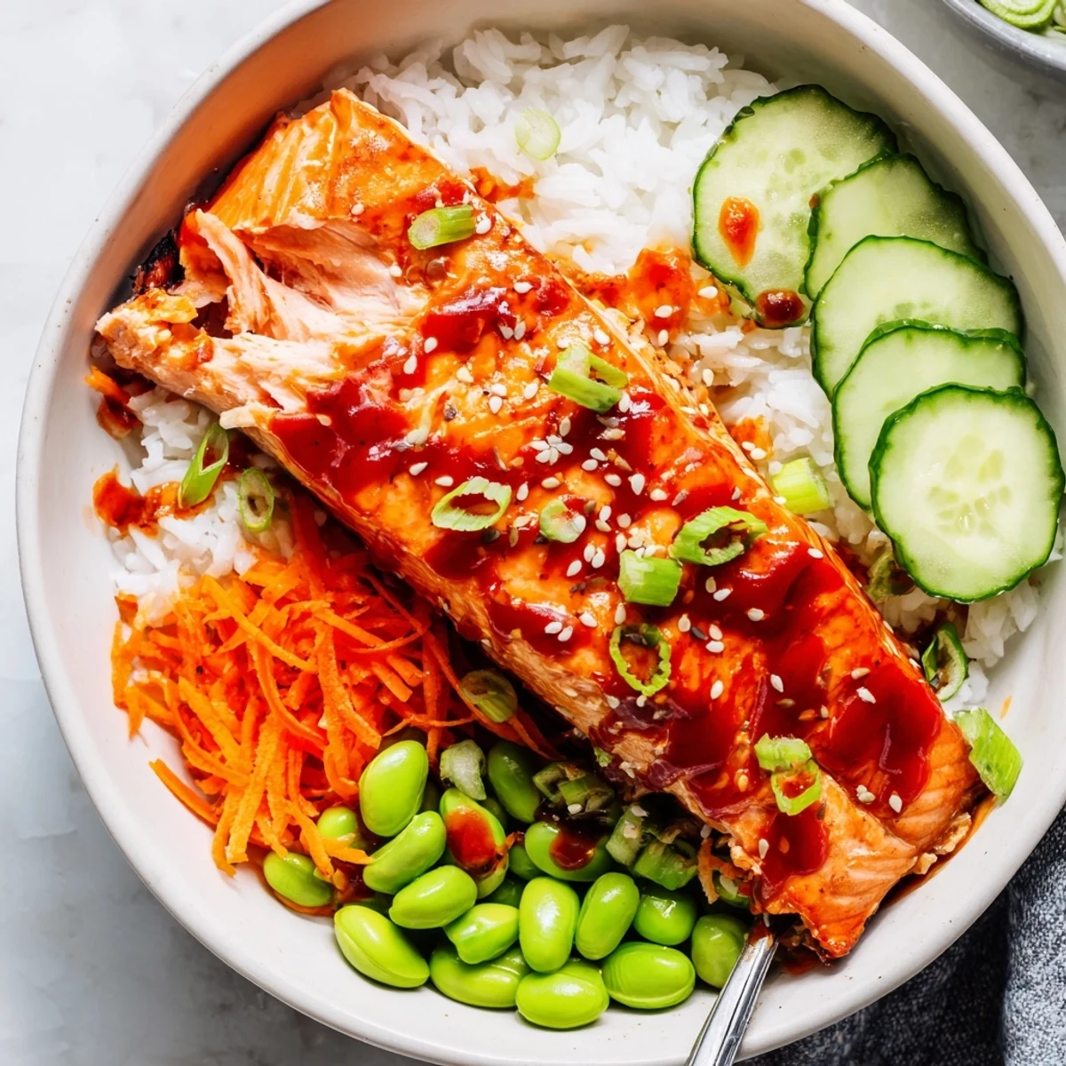 Glossy sriracha honey glazed salmon bowls with caramelized fillets over steamed rice and crisp vegetables