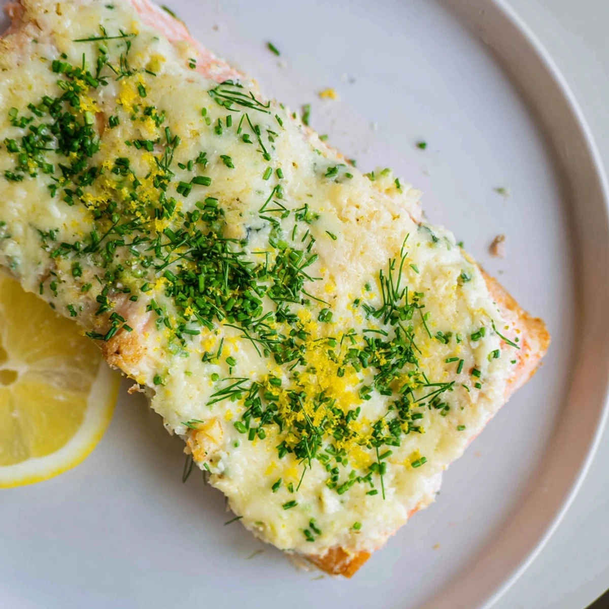 Creamy Boursin salmon fillets baked golden with fresh herbs and lemon zest