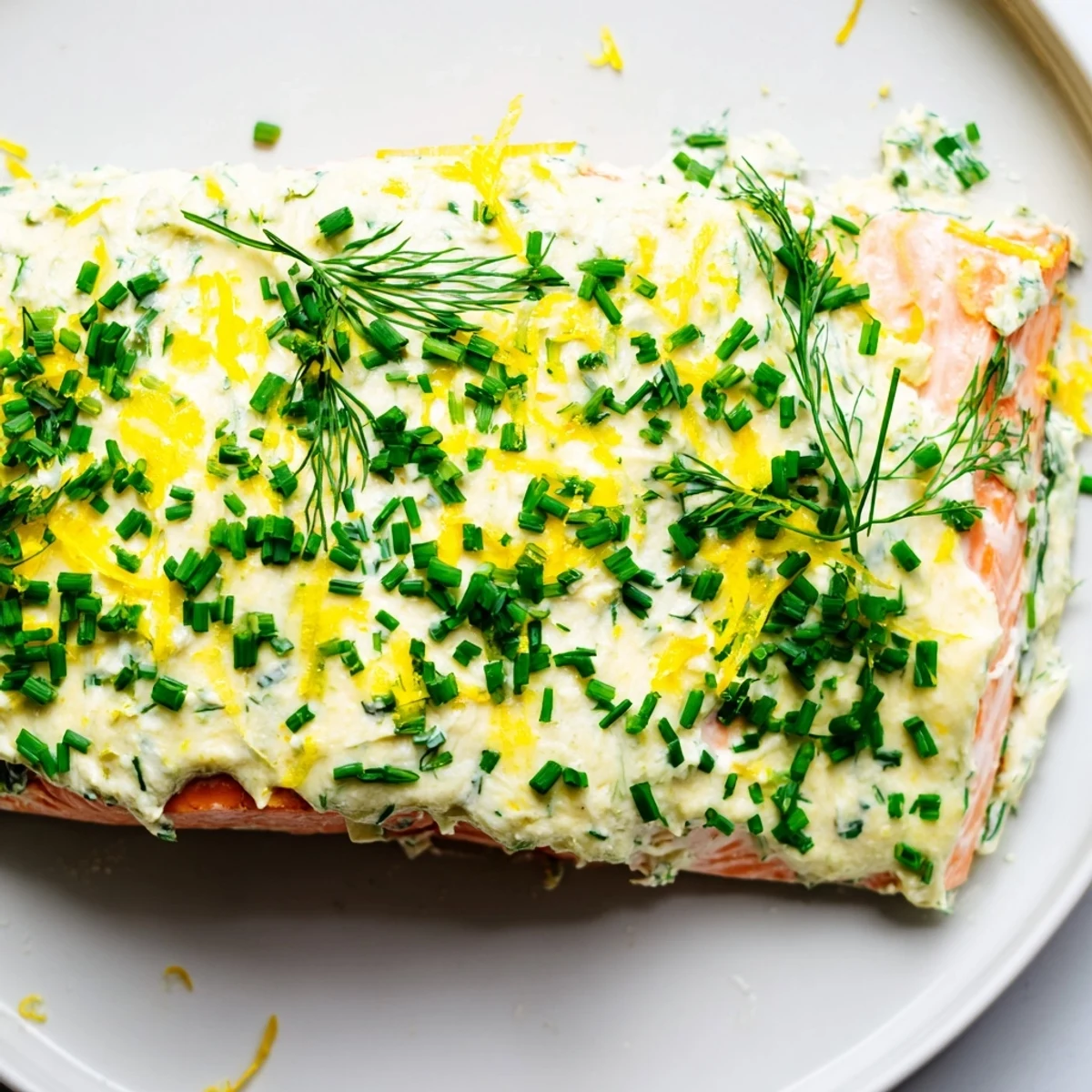 Perfectly baked Boursin salmon topped with melted garlic herb cheese and chives
