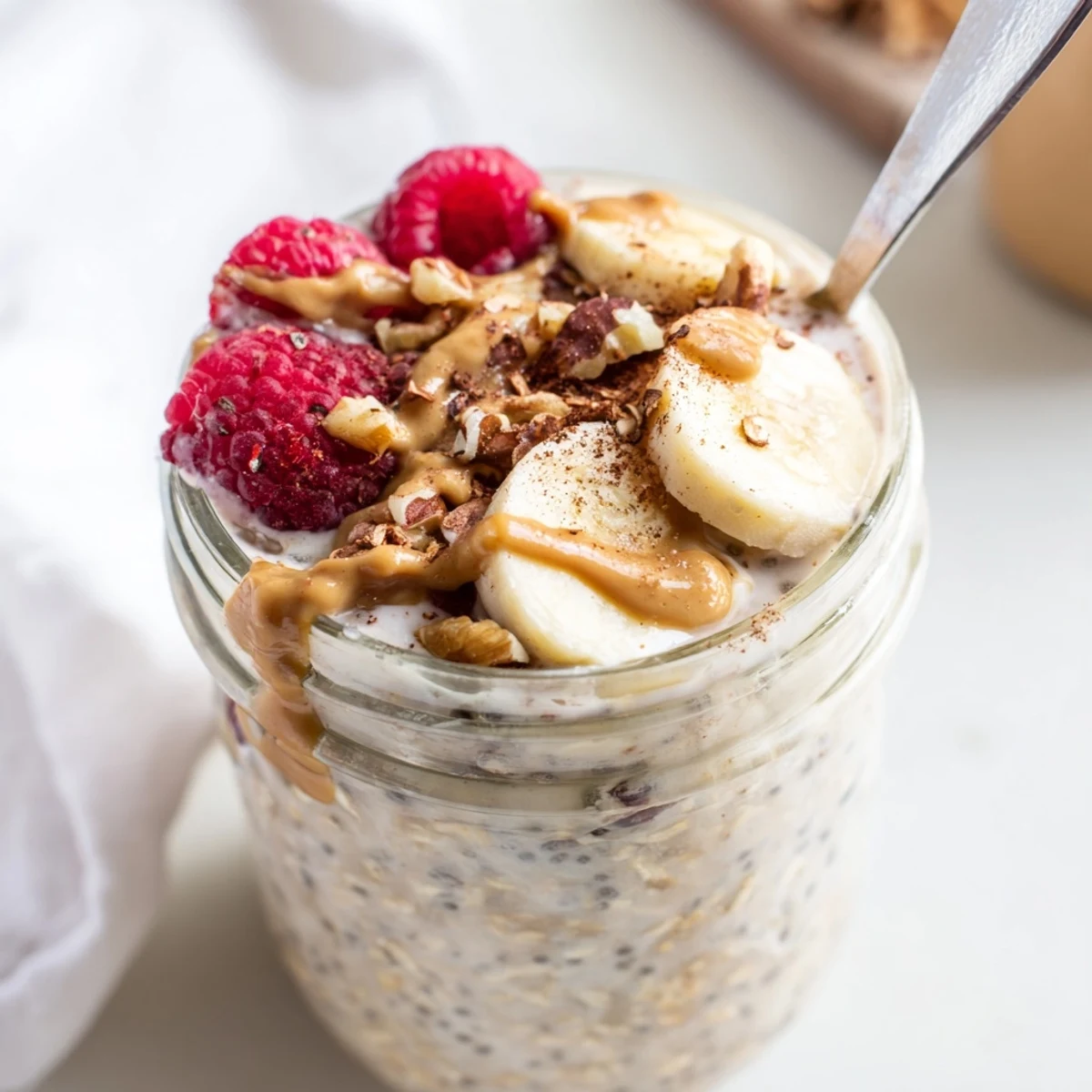 Thick protein overnight oats swirled with vanilla Greek yogurt and chia seeds