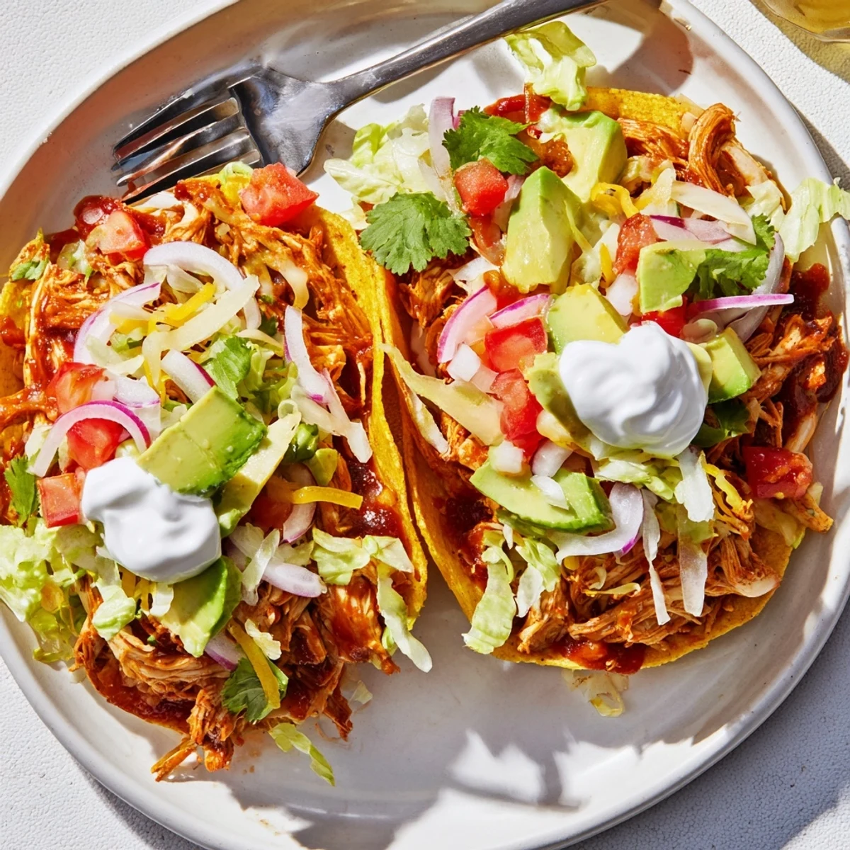 Golden corn shells piled high with tender sweet smoky BBQ chicken and melted cheddar cheese