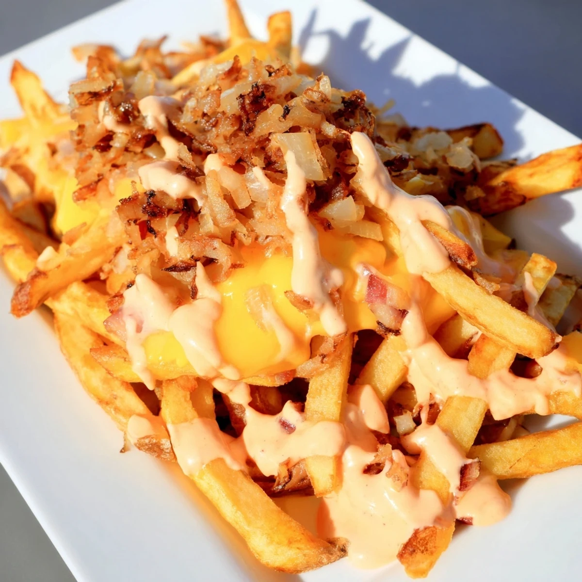 Crispy In N Out Animal Style Fries loaded with melted cheese and caramelized onions