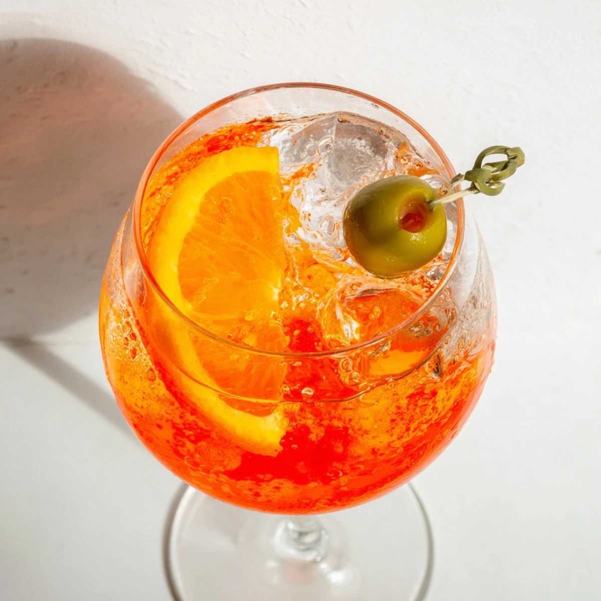 Refreshing Italian Spritz aperitif served chilled with olives and citrus garnish.